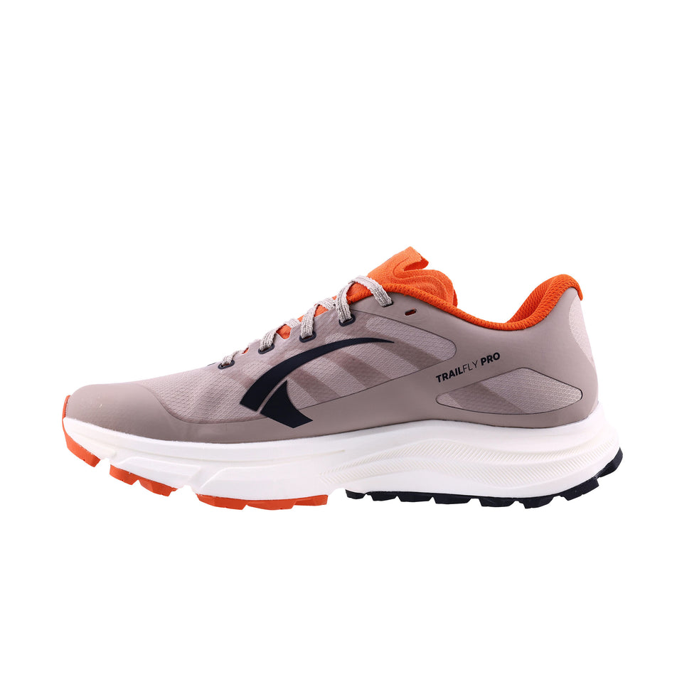 Medial view of the right shoe from a pair of INOV8 Men's TrailFly Pro Running Shoes in the Light Brown/Orange colourway.