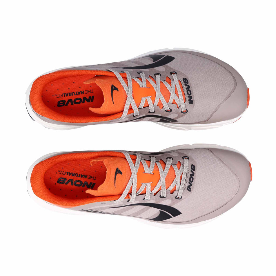 The uppers of a pair of INOV8 Men's TrailFly Pro Running Shoes in the Light Brown/Orange colourway.