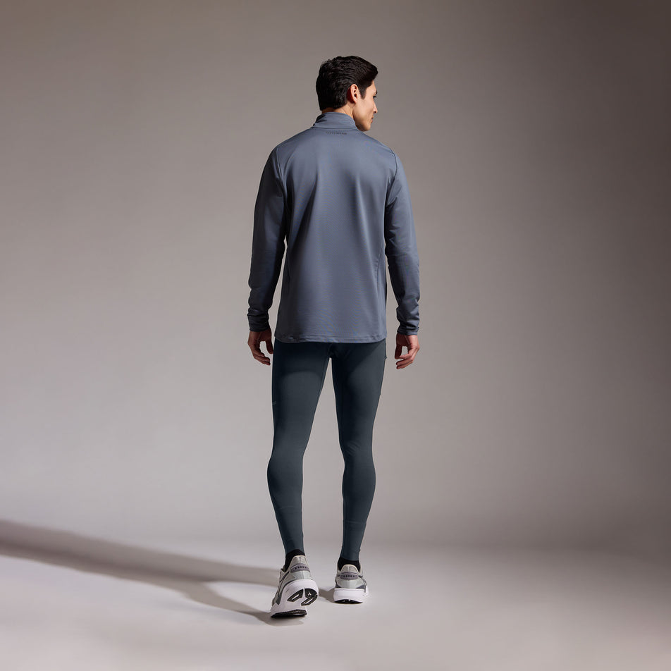Back view of a model wearing the GOREWEAR Men's Concurve Tights in the Lab Graphite colourway. (8752074293410)