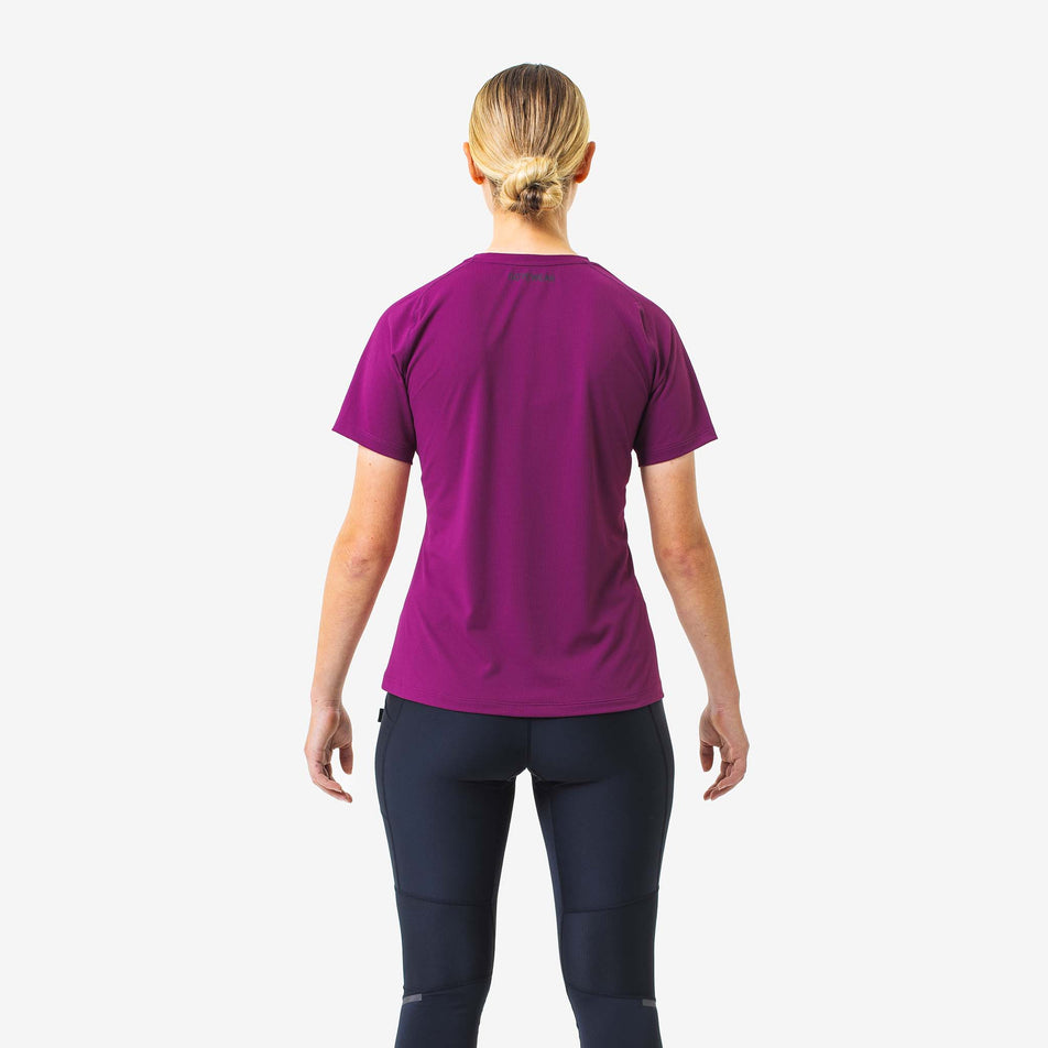 Back view of a model wearing a GOREWEAR Women's Everyday Solid Tee in the Process Purple colourway. Model is also wearing leggings. (8166513442978)
