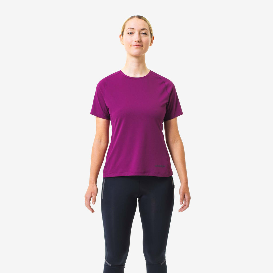 Front view of a model wearing a GOREWEAR Women's Everyday Solid Tee in the Process Purple colourway. Model is also wearing leggings. (8166513442978)