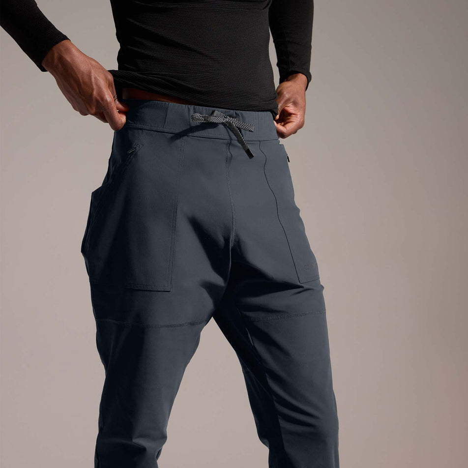 Front view of a model wearing the GOREWEAR Men's Everyday Track Pants in the Lab Graphite colourway. (8752076423330)