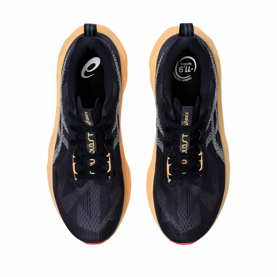 The uppers of a pair of ASICS Men's Novablast 5 Running Shoes in the Midnight/Orange colourway. (8669077307554)