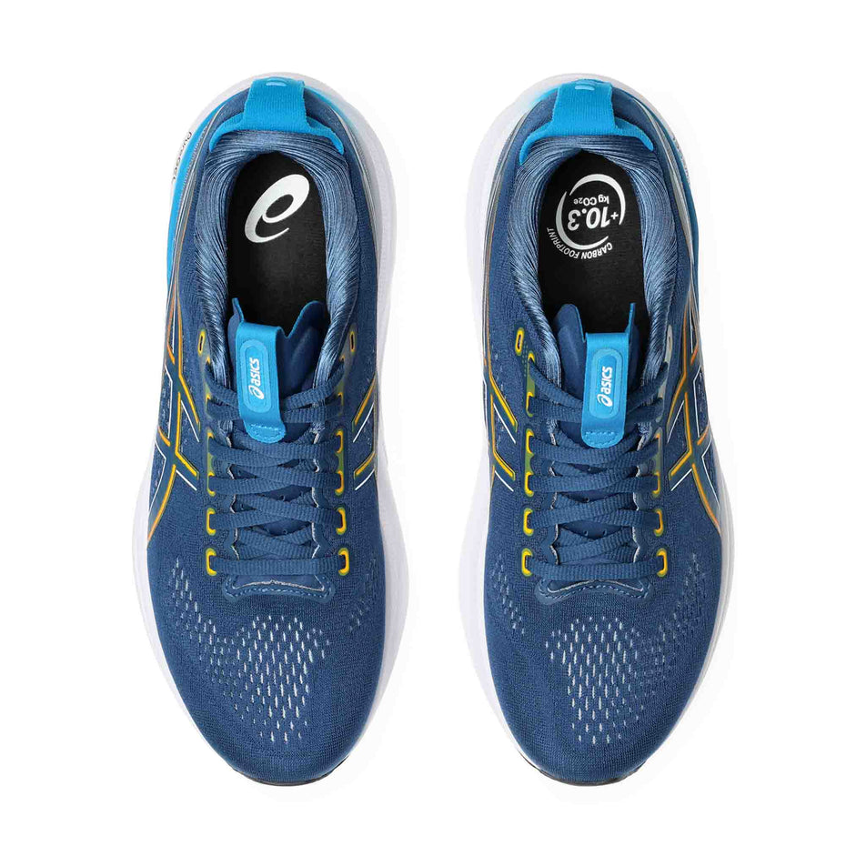 The uppers of a pair of ASICS Men's Gel-Kayano 32 Running Shoes in the Twilight Blue/Anzu colourway.