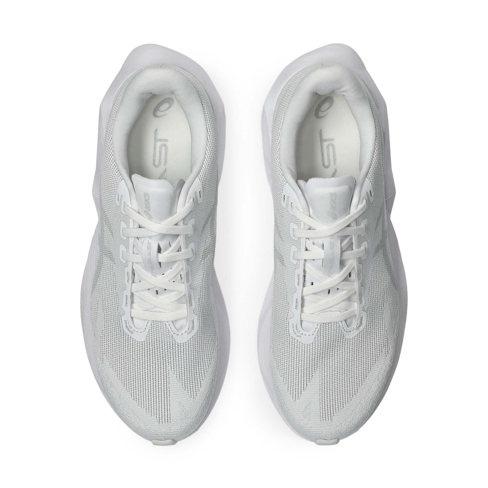 The uppers of a pair of ASICS Men's Novablast 6 Running Shoes in the White/White colourway.