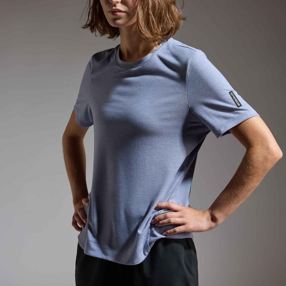 Angled view of a model wearing the GOREWEAR Women's Training Tee in the Amethyst Grey colourway.
