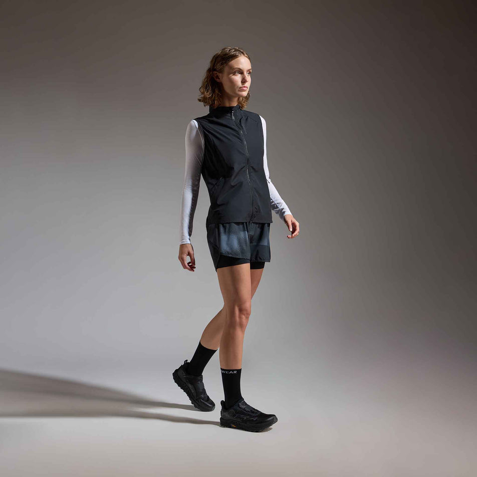 Angled view of a model wearing the GOREWEAR Women's Concurve 3