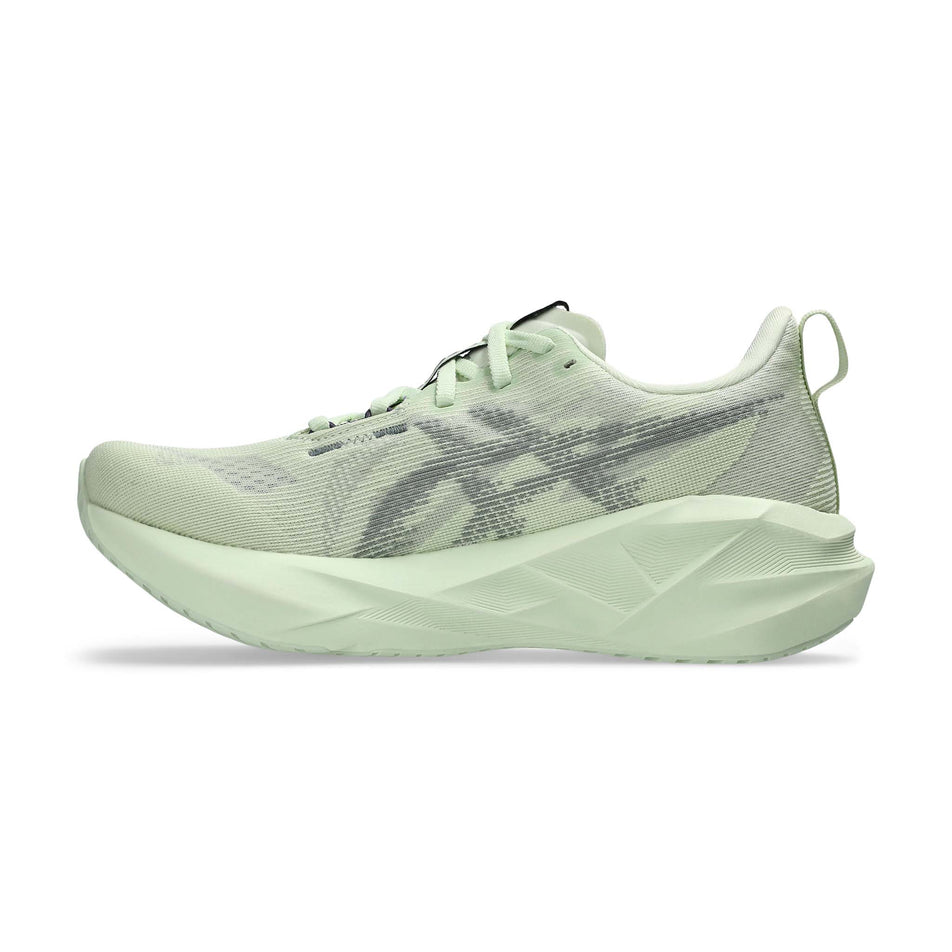 Medial view of the right shoe from a pair of ASICS Women's Novablast 5 Running Shoes in the Whisper Green/Monument colourway. (8669097984162)