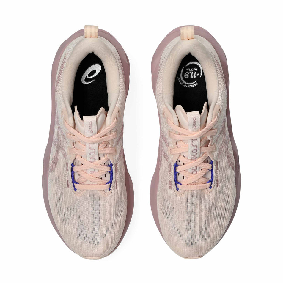 The uppers of a pair of ASICS Women's Novablast 5 Running Shoes in the Pearl/Morganite colourway.