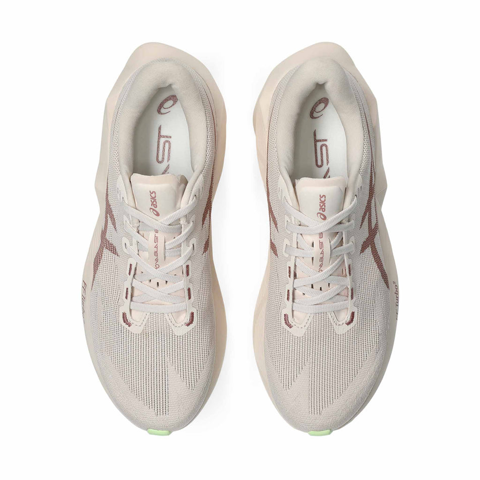 The uppers of a pair of ASICS Women's Novablast 6 Running Shoes in the Rose Dust/Illuminate Yellow colourway.
