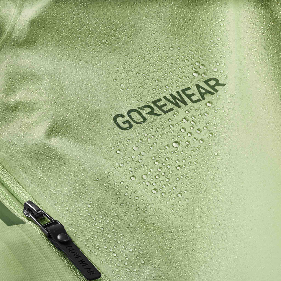 Close-up view of the GOREWEAR Women's Concurve GORE-TEX Logo Jacket in the Spring Green/Slate Green colourway.