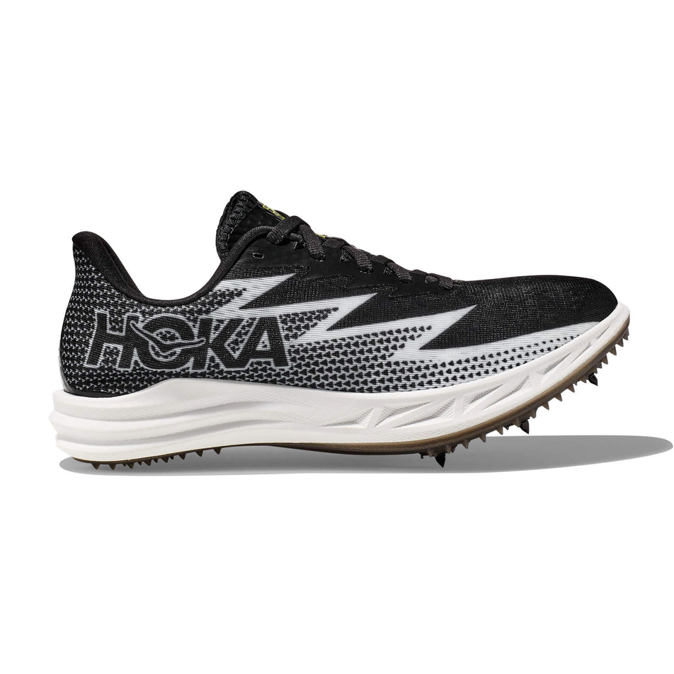 Lateral side of the right shoe from a pair of HOKA Unisex Crescendo MD Running Spikes in the Black/White colourway (8232934899874)