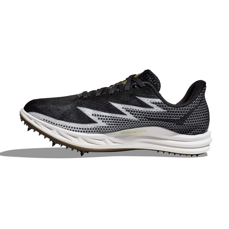 Medial side of the right shoe from a pair of HOKA Unisex Crescendo MD Running Spikes in the Black/White colourway (8232934899874)