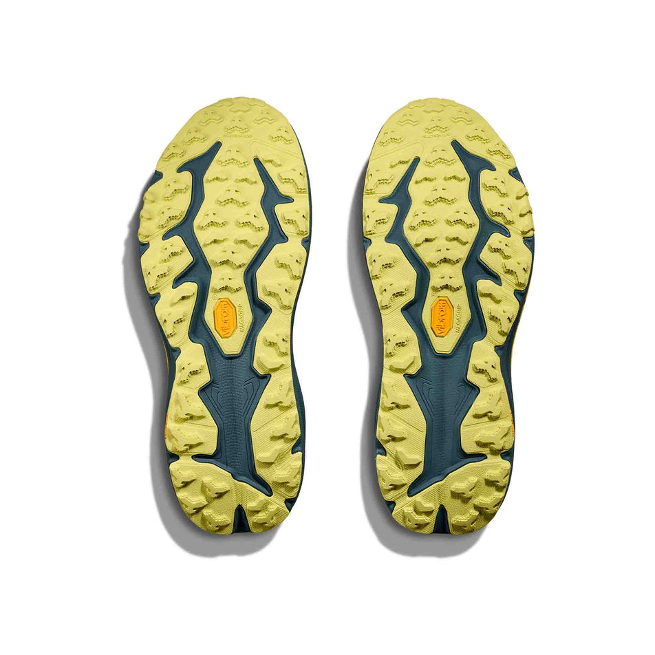 The outsoles of a pair of HOKA Men's Speedgoat 6 Running Shoes in the Terra Cotta/Mountain Fog colourway. (8580384161954)