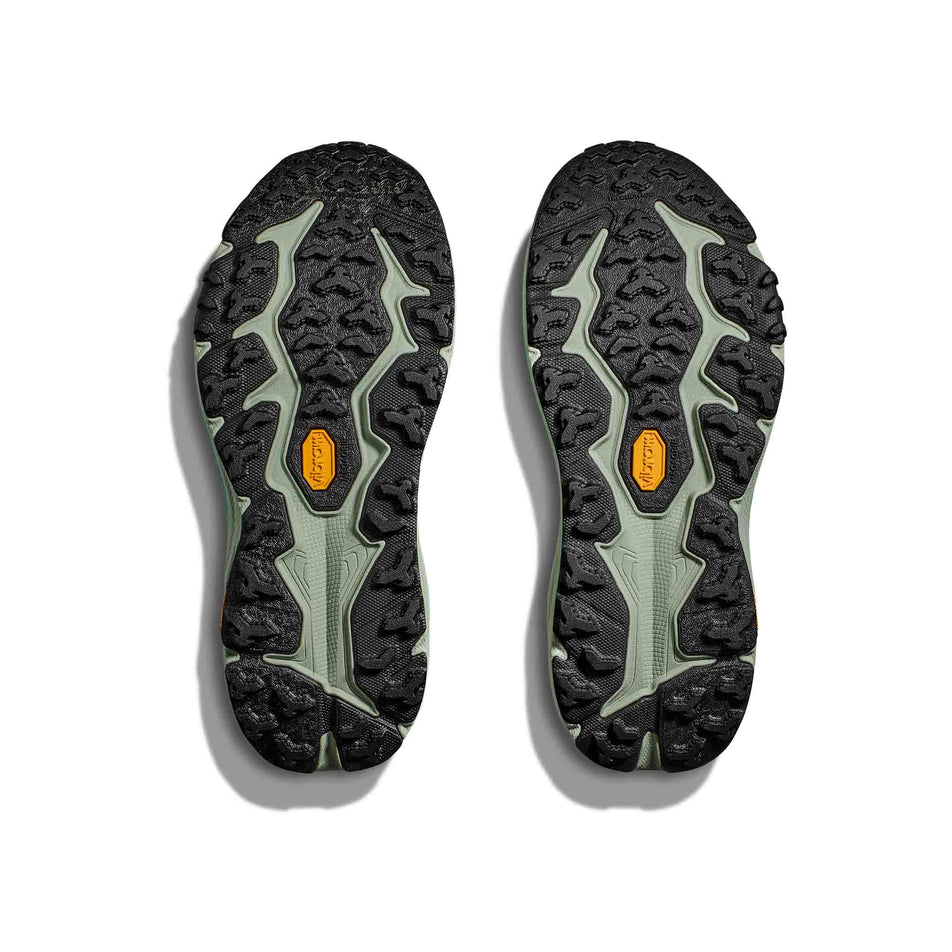 The outsoles on a pair of HOKA Women's Speedgoat 6 Running Shoes in the Black/Aloe Vera colourway (8400138567842)