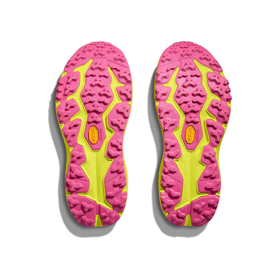 The outsoles of a pair of HOKA Women's Speedgoat 6 Running Shoes in the Black/Neon Hoka Citrus colourway. (8689341759650)