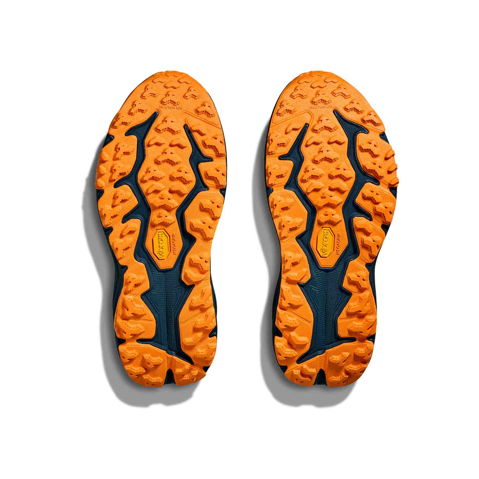 The outsoles of a pair of HOKA Women's Speedgoat 5 Running Shoes in the Feldspar/Blue Twilight colourway. (8637875159202)