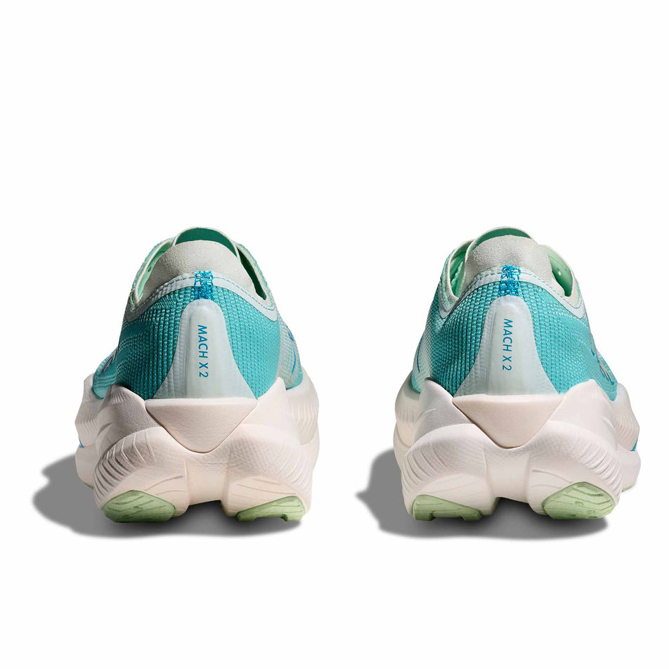 The back of a pair of HOKA Women's Mach X 2 Running Shoes in the Snow Melt/Blue Spark colourway. (8580389666978)