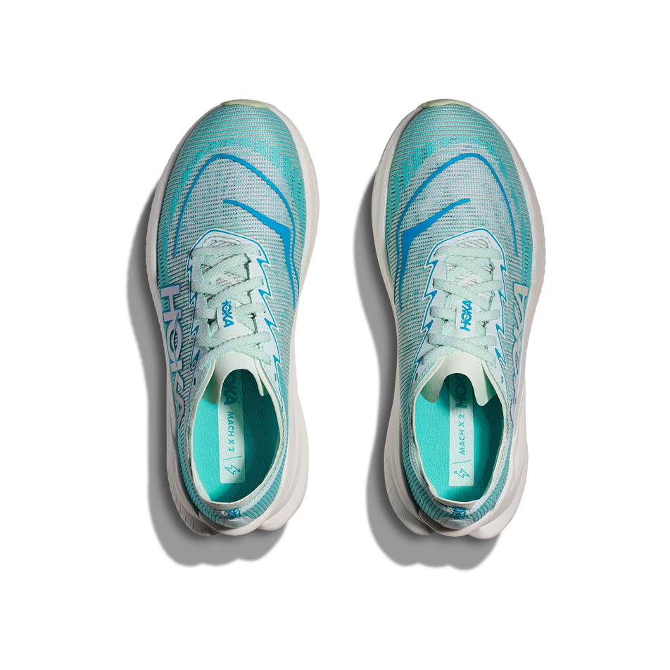 The uppers of a pair of HOKA Women's Mach X 2 Running Shoes in the Snow Melt/Blue Spark colourway. (8580389666978)