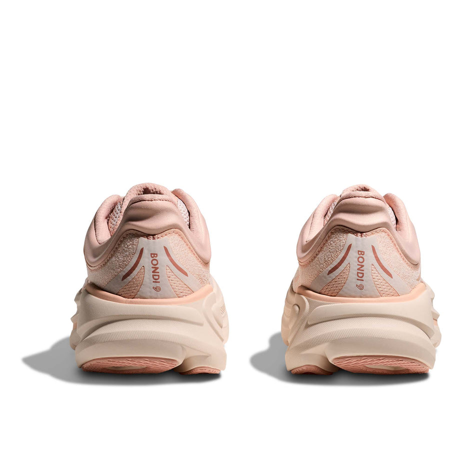 The back of a pair of HOKA Women's Bondi 9 Running Shoes in the Rose Latte/Rose Cream colourway. (8689288937634)