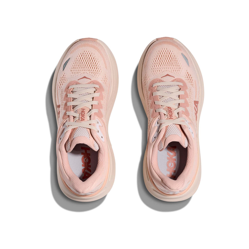 The uppers of a pair of HOKA Women's Bondi 9 Running Shoes in the Rose Latte/Rose Cream colourway. (8689288937634)