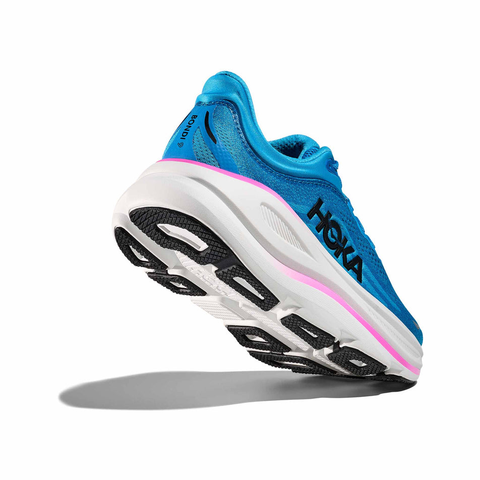 Lateral - and outsole - view of the right shoe from a pair of HOKA Women's Bondi 9 Running Shoes in the Skyward Blue/Neon Fuchsia colourway. (8689287463074)