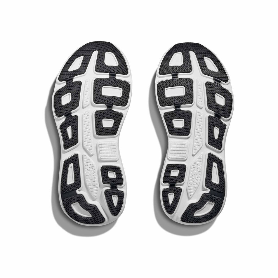 The outsoles of a pair of HOKA Women's Bondi 9 Running Shoes in the Skyward Blue/Neon Fuchsia colourway. (8689287463074)