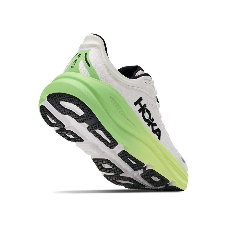 Lateral - and outsole - view of the right shoe from a pair of HOKA Women's Bondi 9 Running Shoes in the White/Tart Apple colourway.