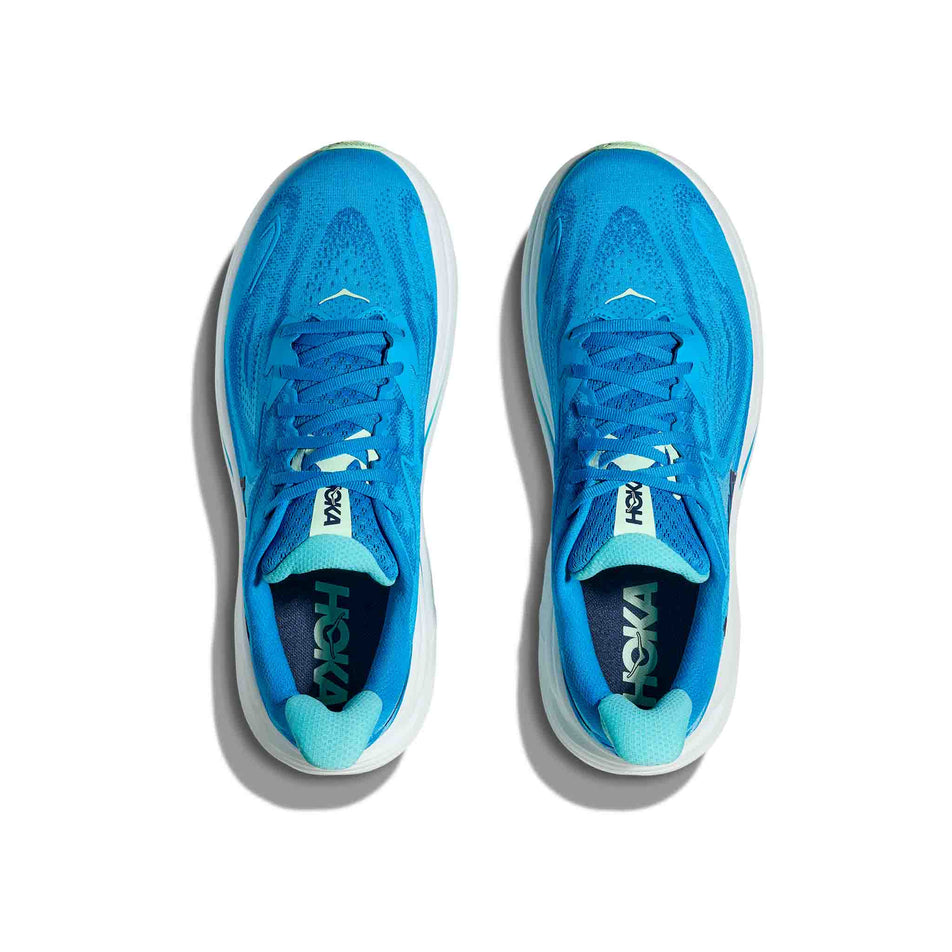 The uppers of a pair of HOKA Men's Clifton 10 Running Shoes in the Hoka Blue/Skyward Blue colourway. (8637720035490)