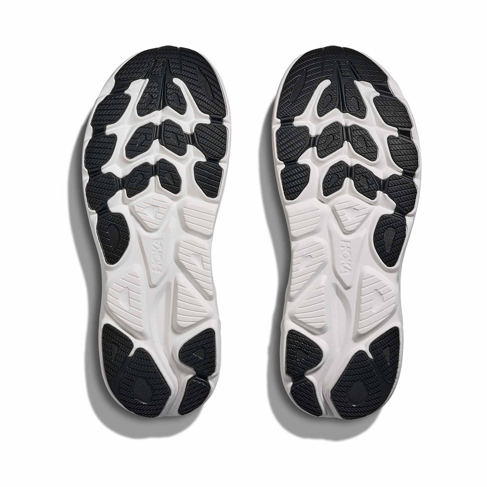 The outsoles of a pair of HOKA Men's Clifton 10 Running Shoes in the Sage/Neon Flame colourway.