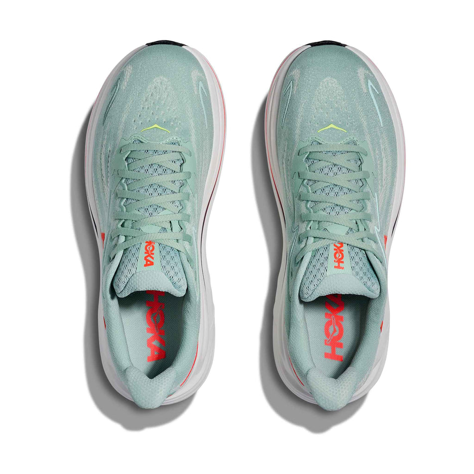 The uppers of a pair of HOKA Men's Clifton 10 Running Shoes in the Sage/Neon Flame colourway.