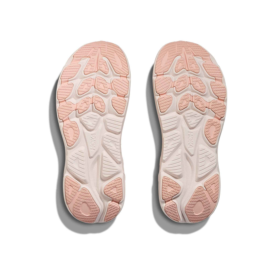 The outsoles of a pair of HOKA Women's Clifton 10 Running Shoes in the Blush/Rose Latte colourway. (8689269244066)