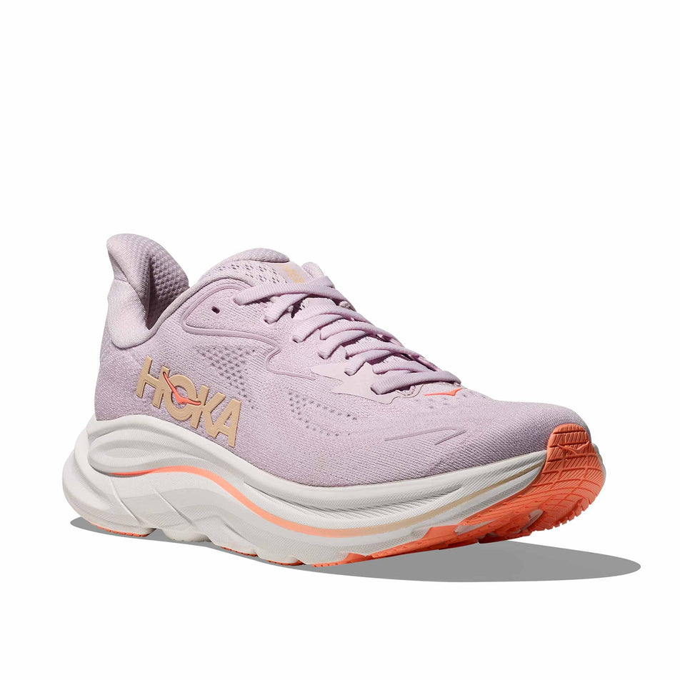Lateral view of the right shoe from a pair of HOKA Women's Clifton 10 Running Shoes in the Lilac Cream/Tangerine Glow colourway.