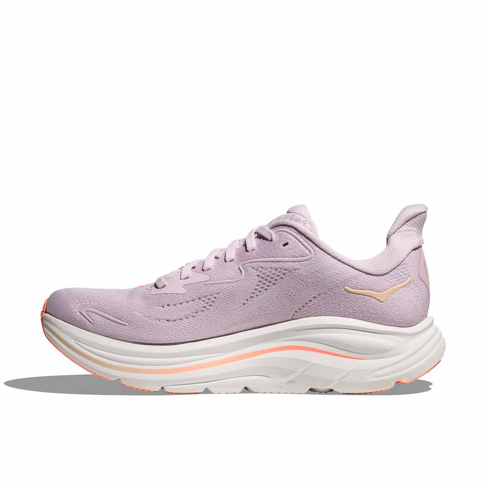 Medial view of the right shoe from a pair of HOKA Women's Clifton 10 Running Shoes in the Lilac Cream/Tangerine Glow colourway.