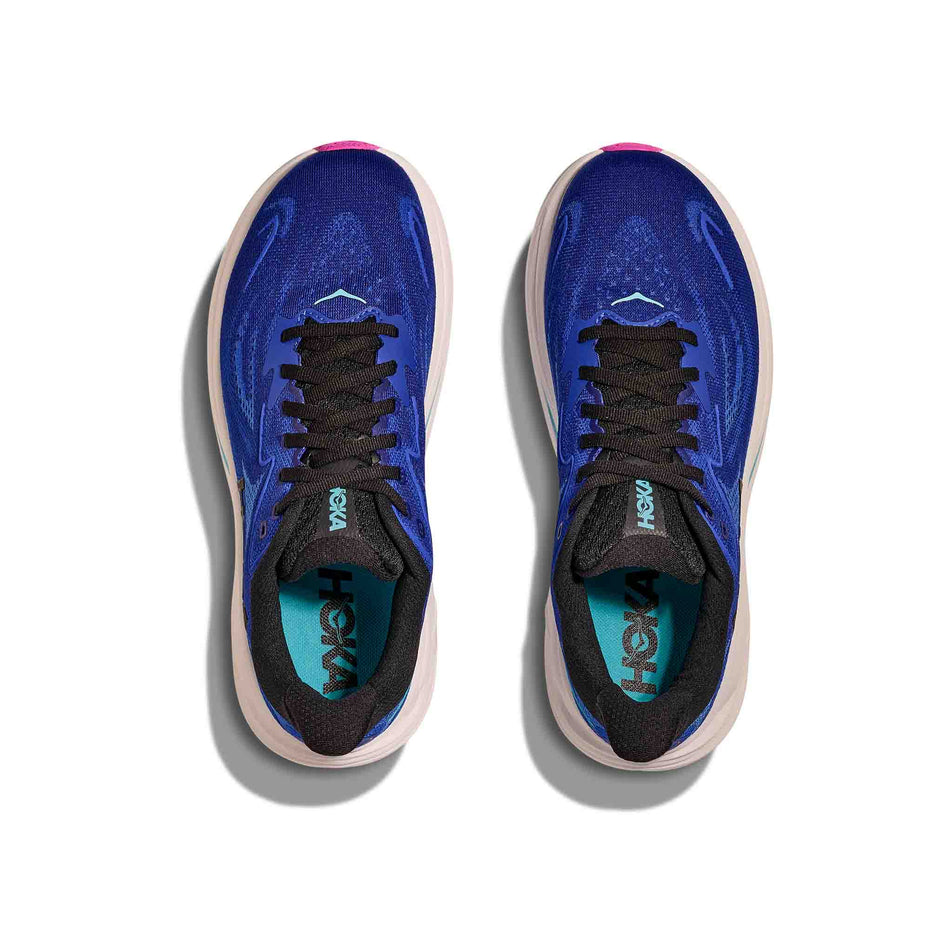 The uppers of a pair of HOKA Women's Clifton 10 Running Shoes in the Night Sky/Ultramarine colourway. (8689257742498)