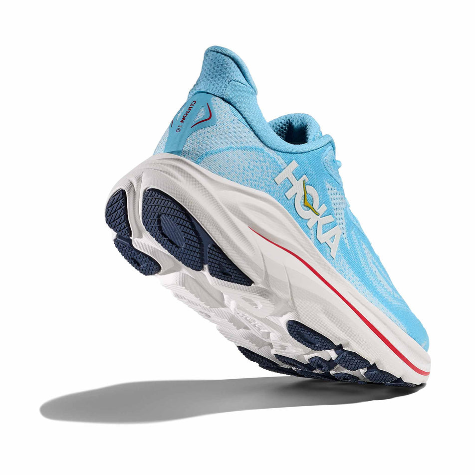 Lateral - and outsole - view of the right shoe from a pair of HOKA Women's Clifton 10 Running Shoes in the Soaring Blue/Frost colourway.