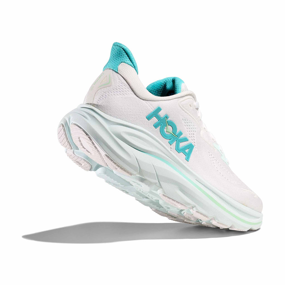 Lateral view - and outsole - of the right shoe from a pair of HOKA Women's Clifton 10 Running Shoes in the White/Cielo Blue colourway. (8637769875618)