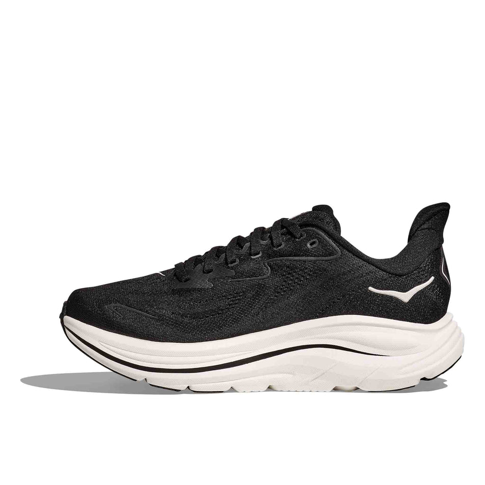 Medial view of the right shoe from a pair of HOKA Women's Clifton 10 Wide Running Shoes in the Black/White colourway. (8637785374882)