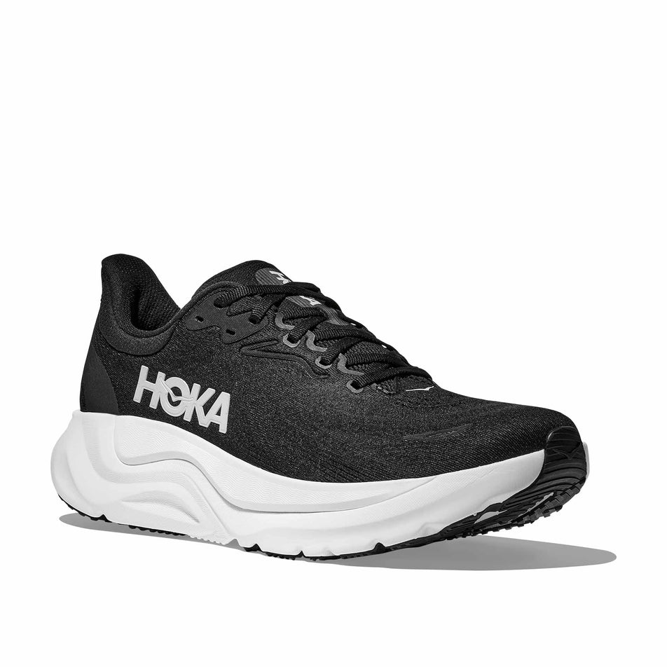 Lateral view of the right shoe from a pair of HOKA Women's Arahi 8 Running Shoes in the Black/White colourway.