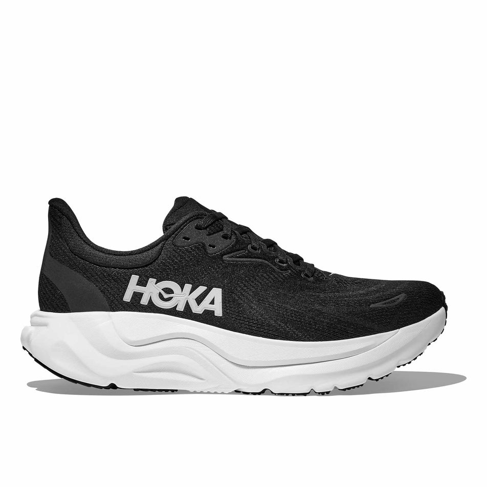 Lateral view of the right shoe from a pair of HOKA Women's Arahi 8 Running Shoes in the Black/White colourway.