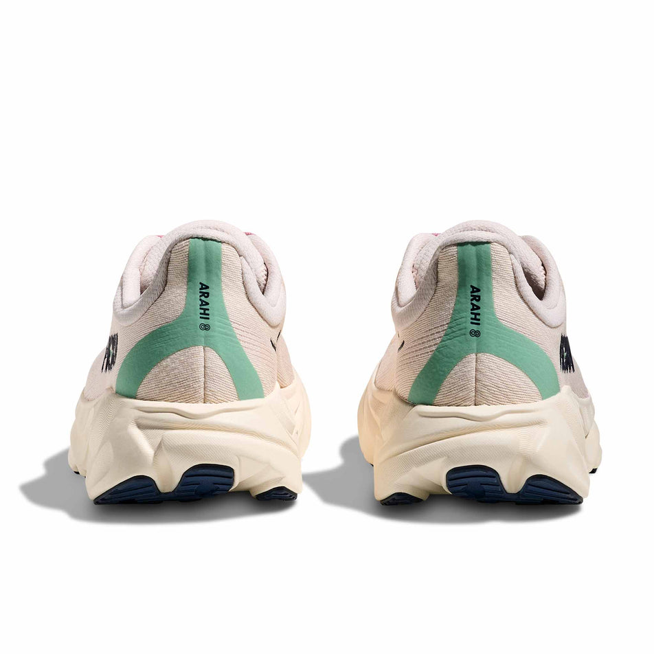 The back of a pair of HOKA Women's Arahi 8 Running Shoes in the Rose Cream/Alabaster colourway. (8689326129314)