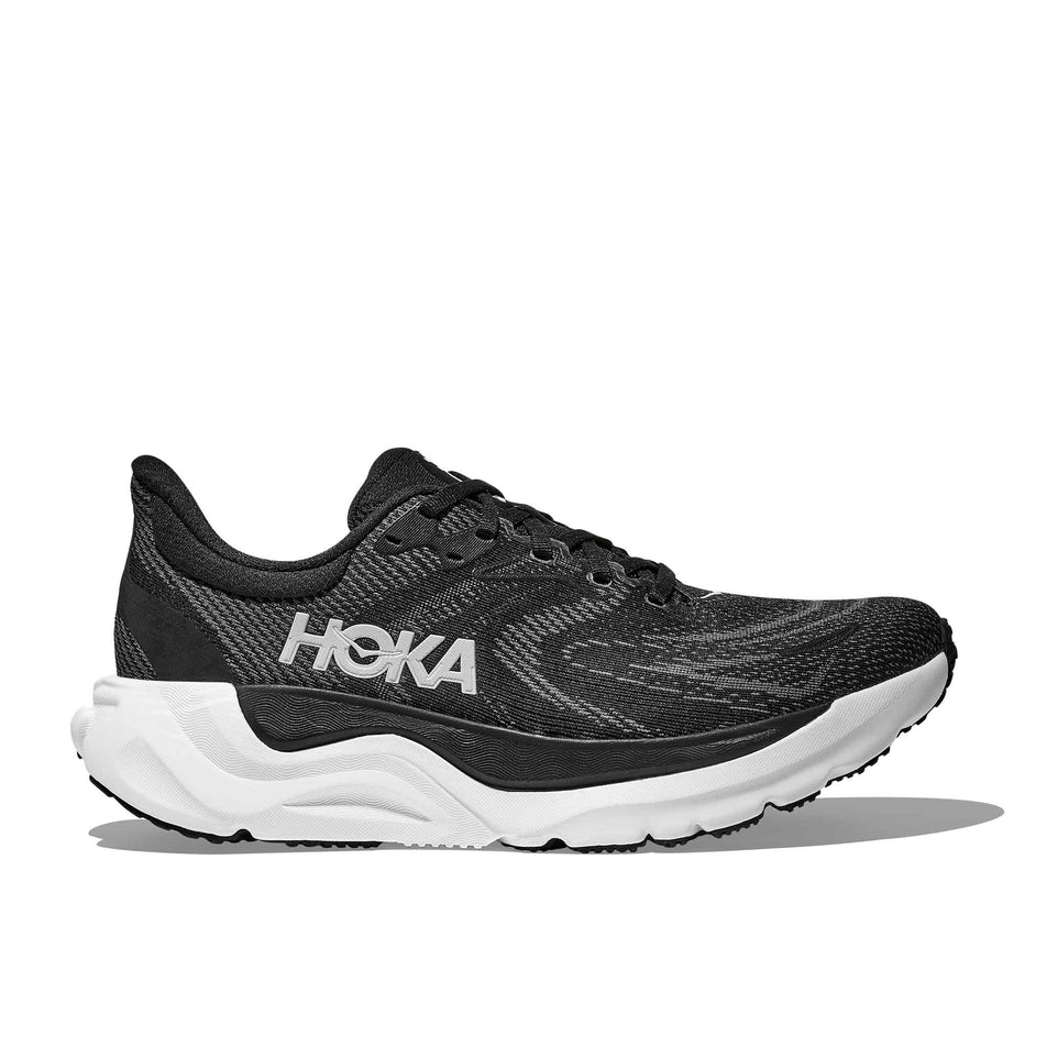 Lateral view of the right shoe from a pair of HOKA Women's Arahi 8 Wide Running Shoes in the Black/White colourway. (8689328947362)