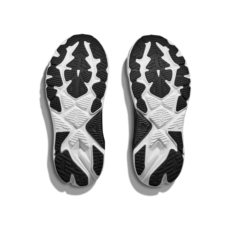 The outsoles of a pair of HOKA Women's Arahi 8 Wide Running Shoes in the Black/White colourway. (8689328947362)