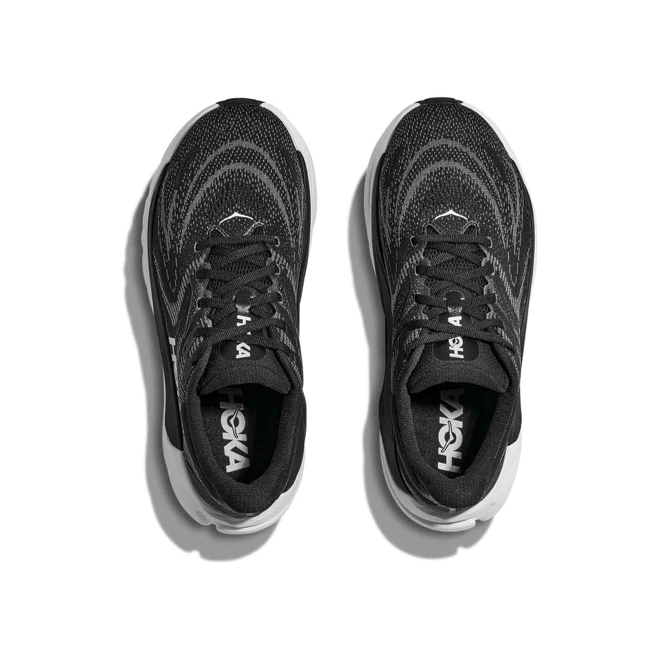 The uppers of a pair of HOKA Women's Arahi 8 Wide Running Shoes in the Black/White colourway. (8689328947362)