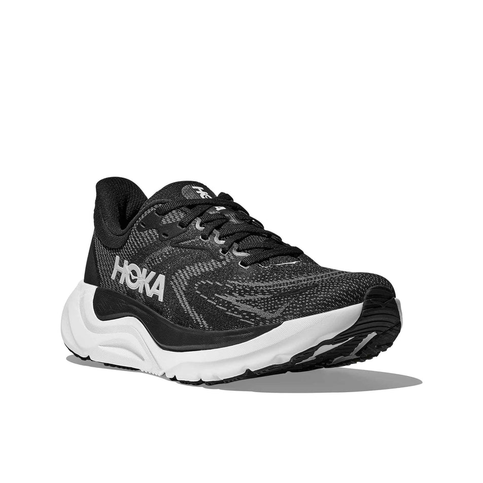 Lateral view of the right shoe from a pair of HOKA Women's Arahi 8 Wide Running Shoes in the Black/White colourway. (8689328947362)