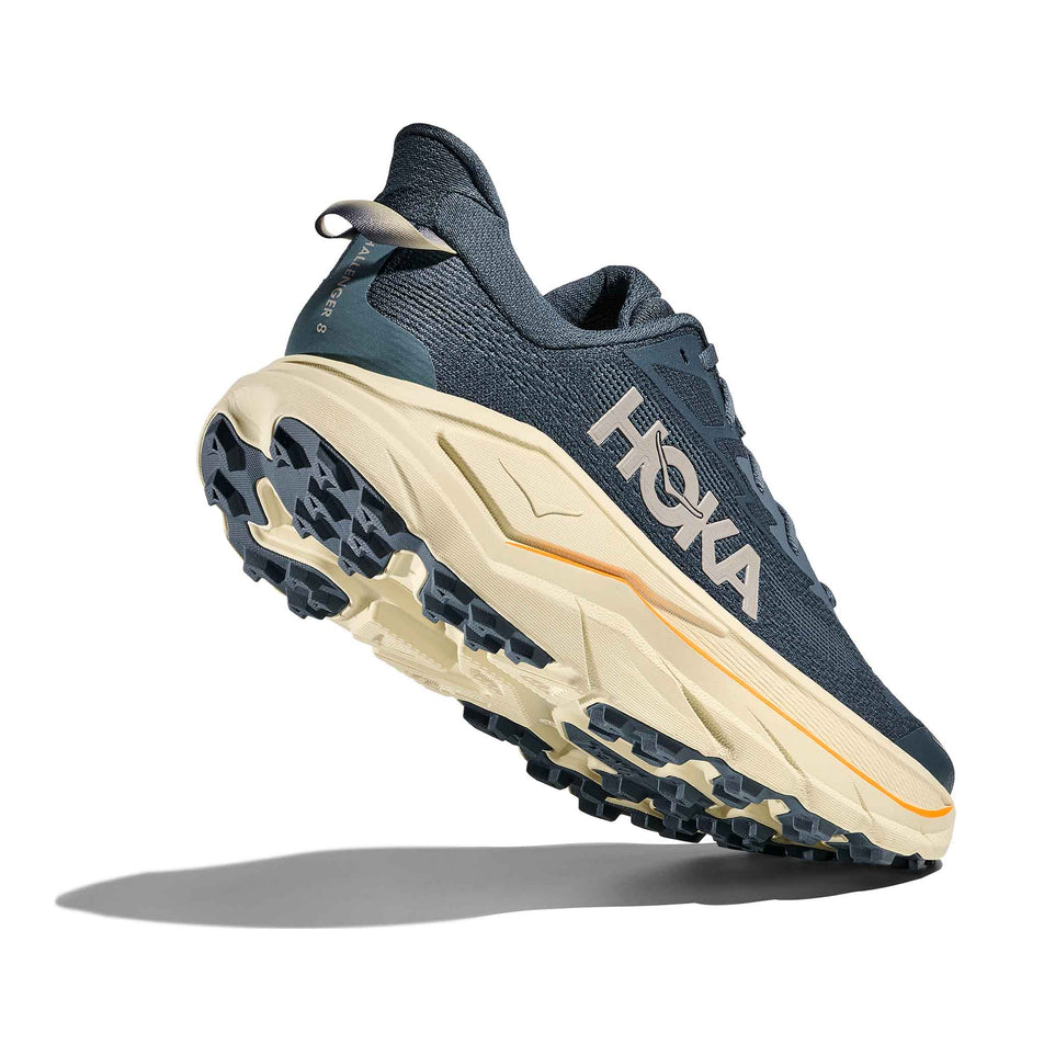 Lateral - and outsole - view of the right shoe from a pair of HOKA Men's Challenger 8 Running Shoes in the Faded Navy/Pampass Grass colourway.