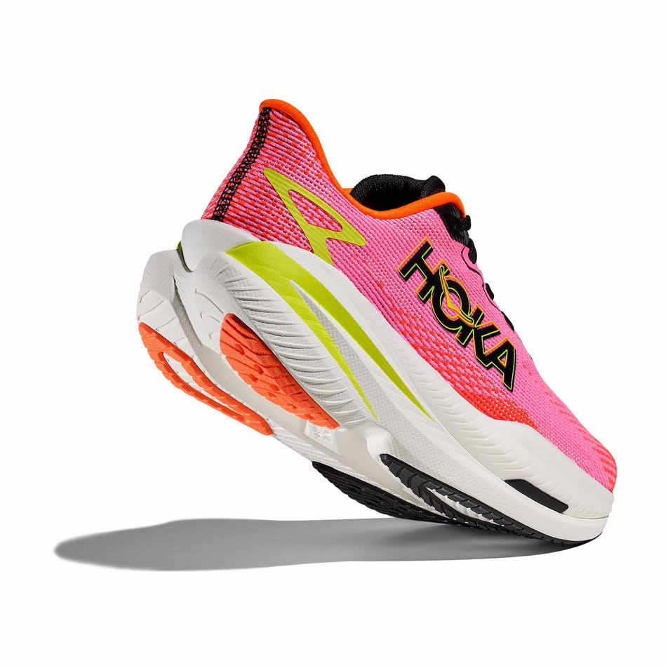 Lateral - and outsole - view of the right shoe from a pair of HOKA Women's Mach X 3 Running Shoes in the Neon Rose/Neon Tangerine colourway. (8689279172770)