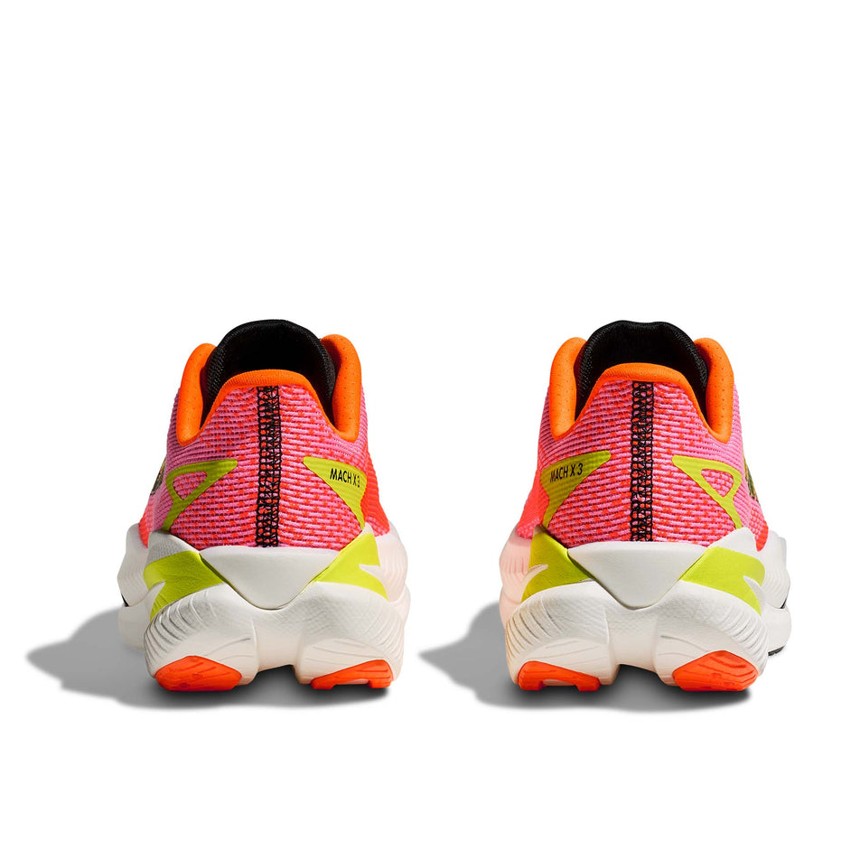 The back of a pair of HOKA Women's Mach X 3 Running Shoes in the Neon Rose/Neon Tangerine colourway. (8689279172770)
