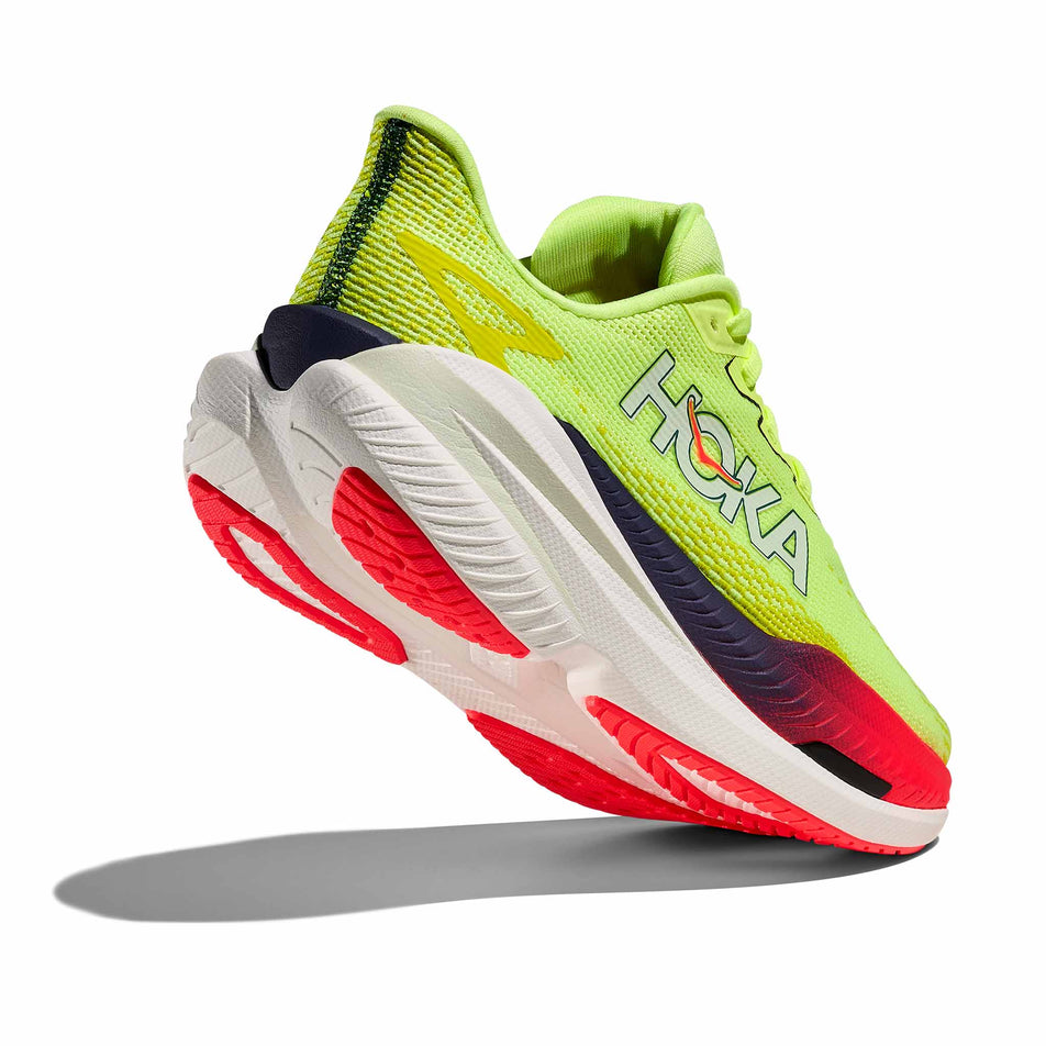Lateral - and outsole - view of the right shoe from a pair of HOKA Women's Mach X 3 Running Shoes in the Neon Yuzu/Squid Ink colourway.
