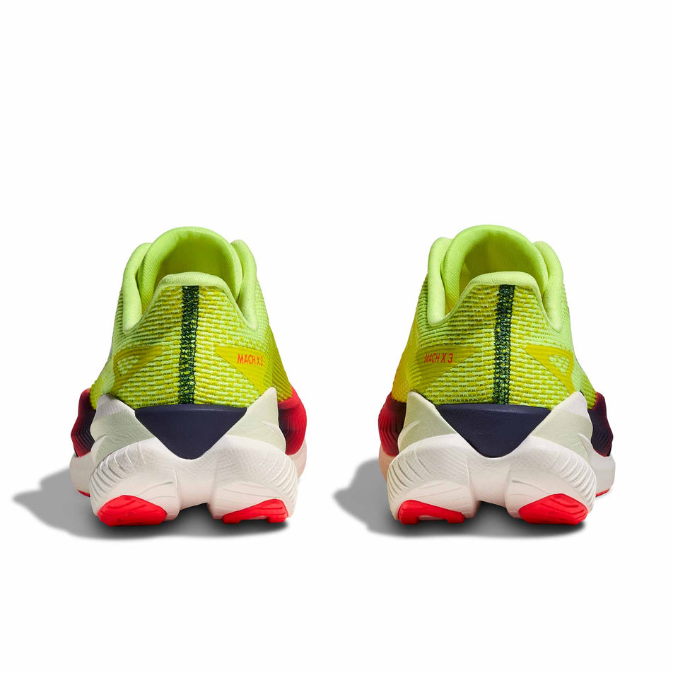 The back of a pair of HOKA Women's Mach X 3 Running Shoes in the Neon Yuzu/Squid Ink colourway.